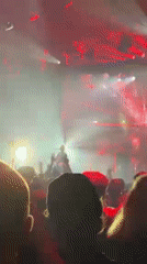 Band performs under colorful lights at London concert