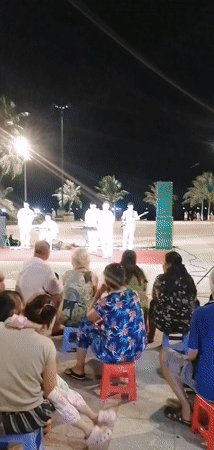 Band in white suits performs for crowd in Nha Trang