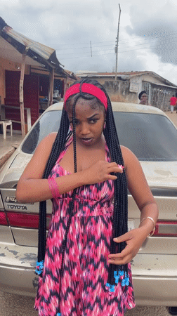 Outdoor photo shoot beside a Toyota Camry in Jos, Nigeria