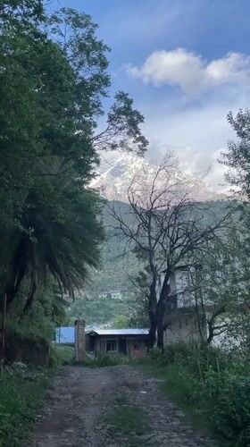 Observer documents mountain views, construction during Dharamshala walk