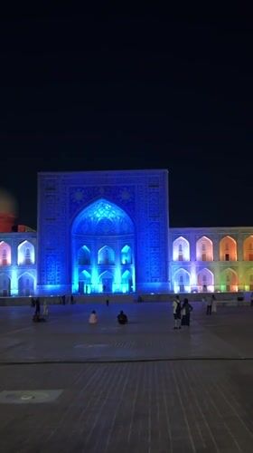 Samarkand's Registan Square glows during a summer evening light show