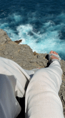 Morning cliff sitting captured at Nusa Penida ocean viewpoint