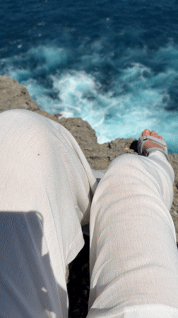 Morning cliff sitting captured at Nusa Penida ocean viewpoint