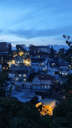 Visitor documents Da Lat scenes: dusk views, luxury homes, dog encounter