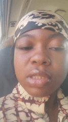 Woman speaks to camera in Kakau, Nigeria morning