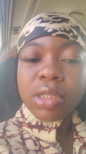 Woman speaks to camera in Kakau, Nigeria morning