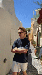 Strolling past blue doors and bougainvillea in Santorini's Oia