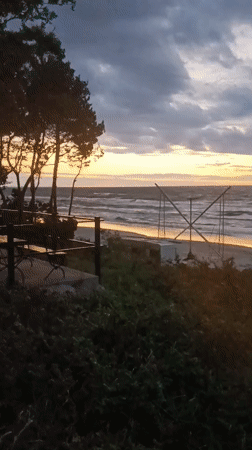 Rough seas and heavy clouds over Stegna beach at dusk