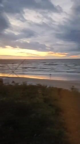Rough seas and heavy clouds over Stegna beach at dusk