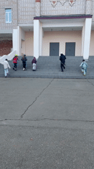 Group climbs building stairs in Sarapul, Russia early morning