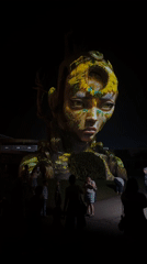 Illuminated face sculptures draw crowds at Kediri art installation