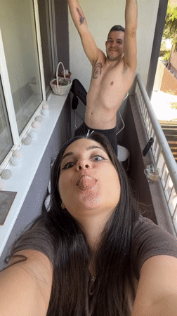 Couple shares morning coffee moment on Sofia balcony