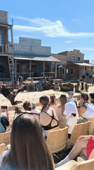 Live Wild West show draws a seated crowd at outdoor attraction
