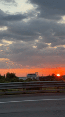 Highway drive under a dramatic sunset sky near Saint Petersburg