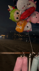 Evening beachfront vendors and visitors captured in Kuta Selatan