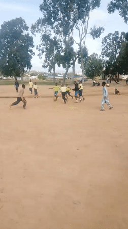 Pickup soccer game on a dusty field