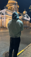Evening visitors gather around illuminated St. Isaac's Cathedral, Saint Petersburg