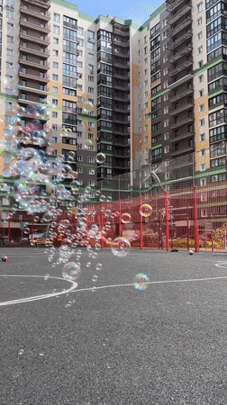 Family creates soap bubble play session at Khimki sports courts
