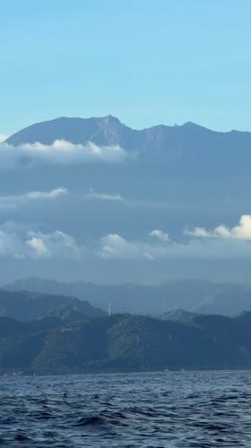 Ocean view of Nusa Penida coastal mountains recorded