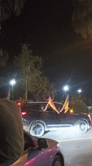 Flag-waving celebration with decorated cars observed in Yenişehir, Turkey