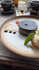 Woman enjoys chocolate dessert at Sidemen restaurant