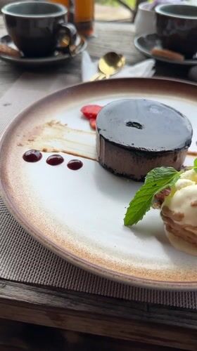 Woman enjoys chocolate dessert at Sidemen restaurant