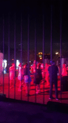 Outdoor DJ night in Aksu draws a dancing crowd under colored lights