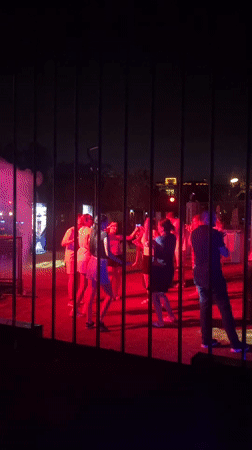 Outdoor DJ night in Aksu draws a dancing crowd under colored lights
