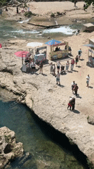 Tourist activity captured along historic Neretva River in Mostar