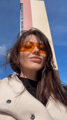 Woman in orange glasses documented around Murino, Russia apartment complex