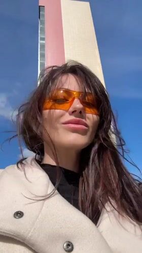 Woman in orange glasses documented around Murino, Russia apartment complex