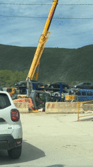 Construction crew operates heavy equipment in rural Montenegro village