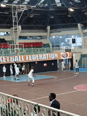 Young women hold basketball practice in Nairobi gymnasium