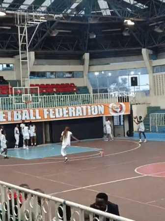 Young women hold basketball practice in Nairobi gymnasium