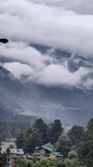 Misty mountain afternoon in Vashisht, clouds heavy over the peaks