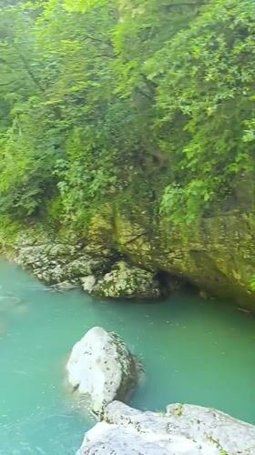Turquoise river flows through Georgia's lush Martvili Canyon