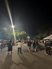 Folk dancing and festivities fill the streets of Malevo at night