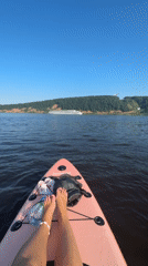 Paddleboarding on a Russian river on a summer afternoon