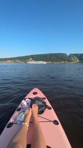 Paddleboarding on a Russian river on a summer afternoon