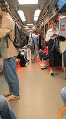 Person leaps mid-air in Moscow metro station amid commuters
