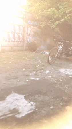 Morning motorcycle traffic flows through three East Java villages