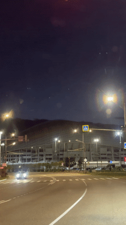 Russian stadium displays changing colored lights at night