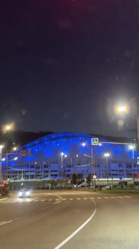 Russian stadium displays changing colored lights at night