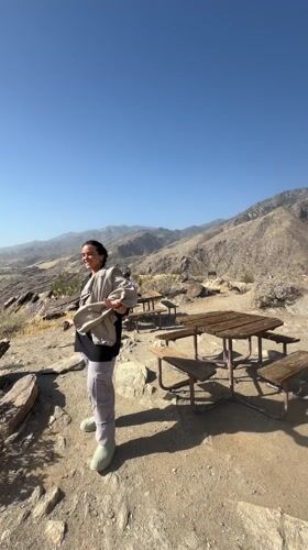 Visitor enjoys mountain overlook views in Palm Springs