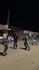 Nighttime rollerblading and scooter activity observed in Jos, Nigeria