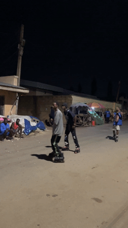 Nighttime rollerblading and scooter activity observed in Jos, Nigeria
