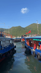 Boats with passengers dock at Vietnam coastal waterway