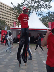 Stilt performer entertains crowds at promotional event in Nairobi