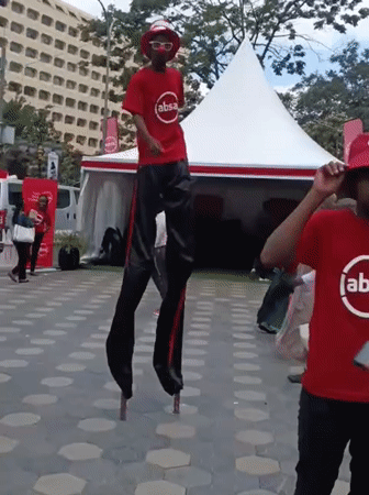 Stilt performer entertains crowds at promotional event in Nairobi