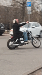 Afternoon moments captured in Riga: motorcyclist and car selfie